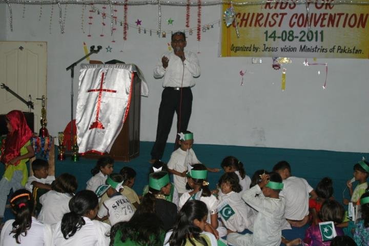 Nadeem Masih preaching the word of God to the kids